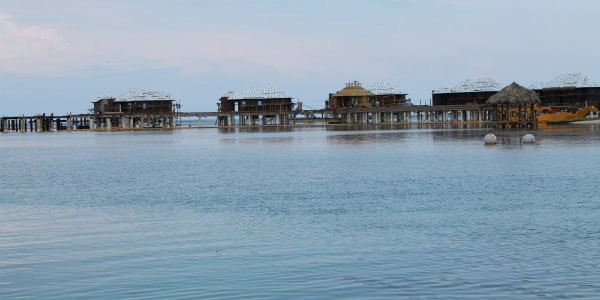 Sailing up to the Over-the-Water Butler Villas, which will open in November.