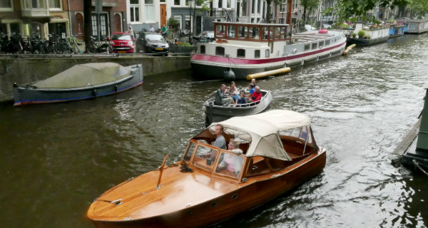 Strolling by one of Amsterdam's many canals.