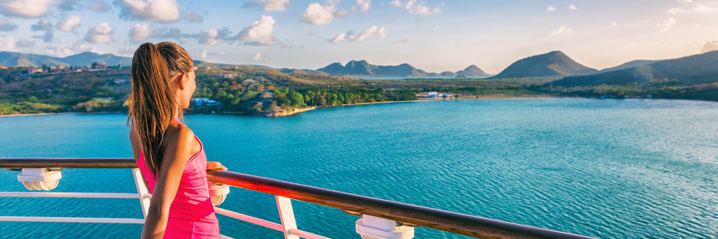 Woman on Cruise Ship Overlooking Ocean