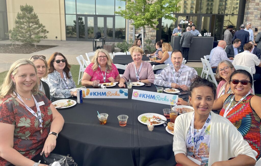 Group at table with drinks and food outdoors