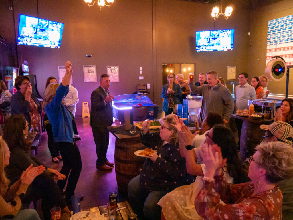 Agents gathered around at the after-even party